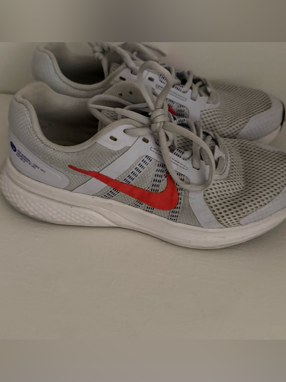 Nike Light Grey Mesh Sneakers with Red Swoosh